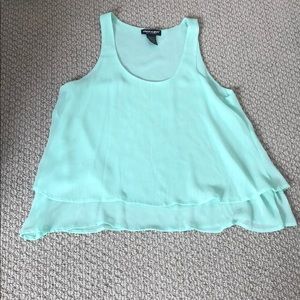 A very thin and flowy mint blouse